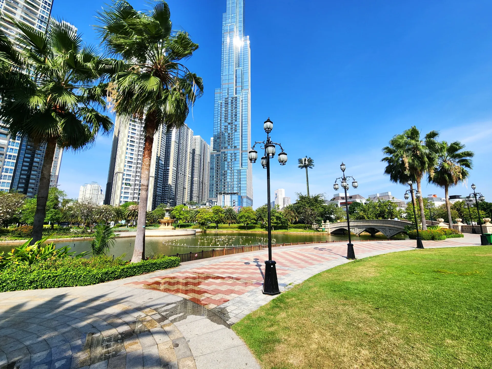  Manicured landscaped park with a background of high rise buildings in Ho Chi Minh City, a popular holiday destination in Vietnam 