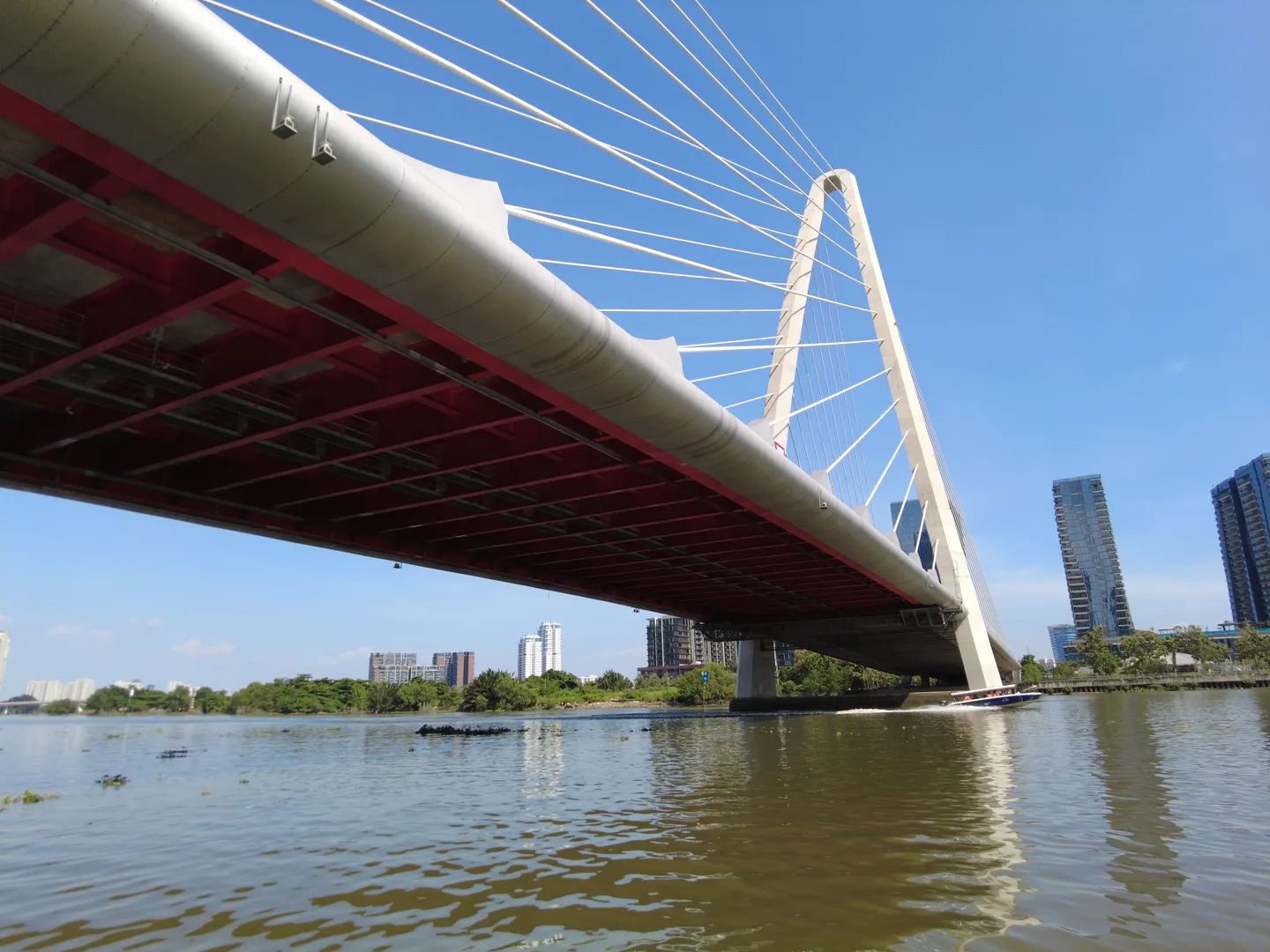  An image of an architectural landmark–a bridge seen from a boat during a cruise tour along Saigon River in Ho Chi Minh City, a popular holiday destination in Vietnam 