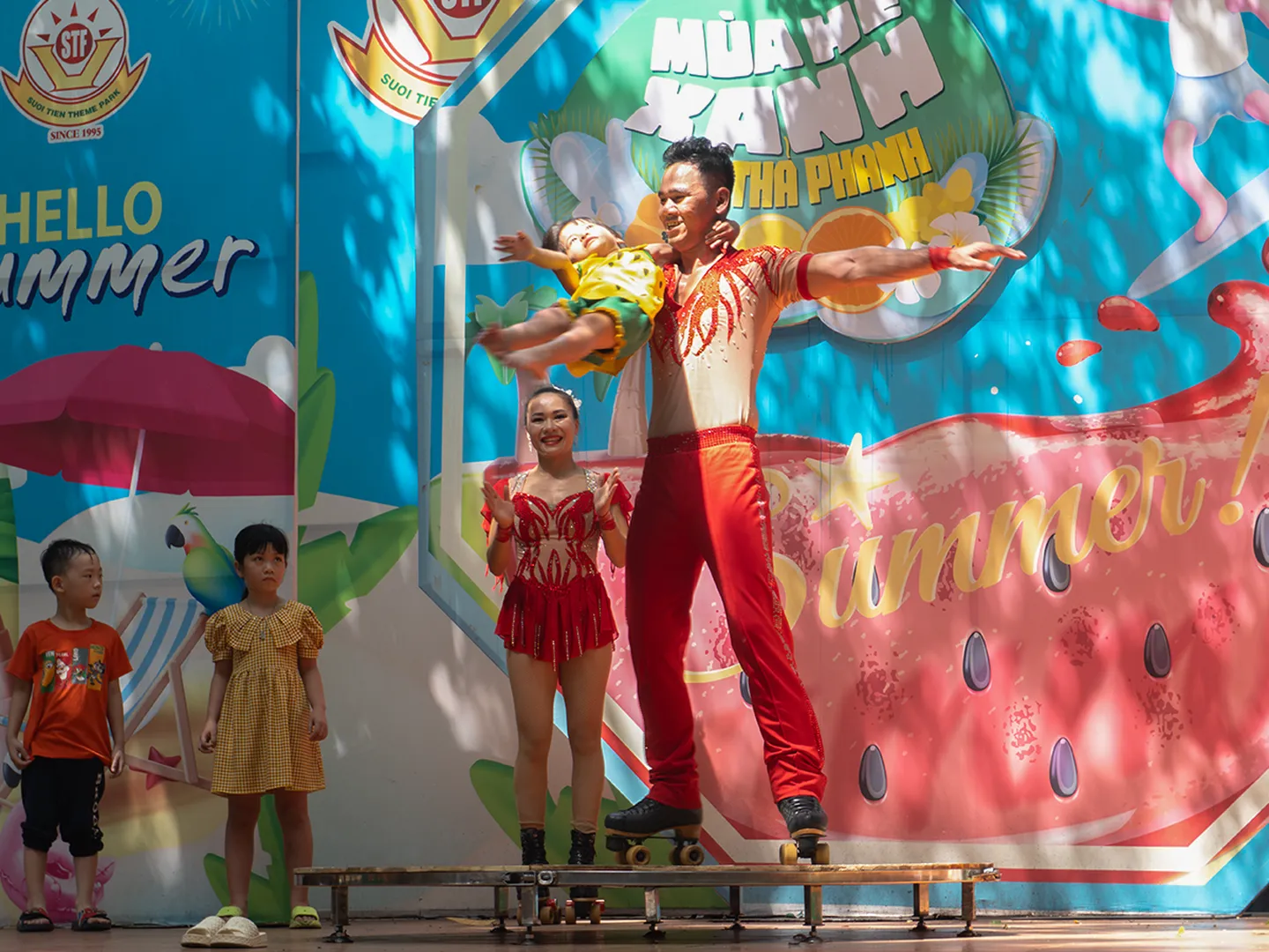 Image of a clown and Patin show performance in Suoi Tien Theme Park in Ho Chi Minh City, a popular holiday destination in Vietnam