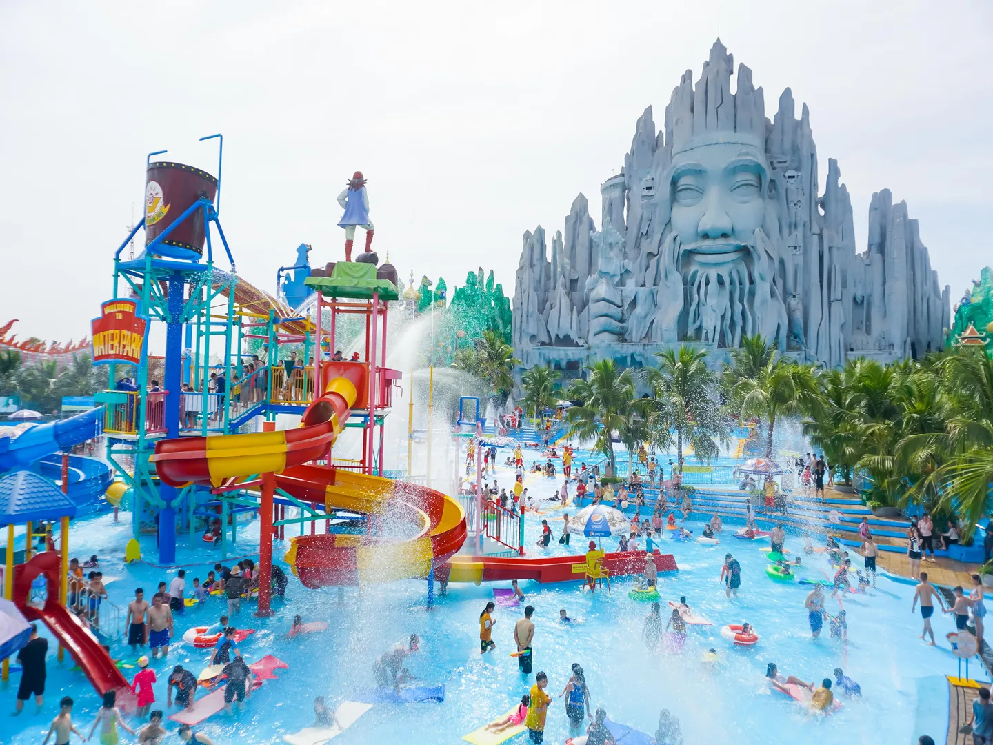  Visitors enjoying splash and swim in a water park in Suoi Tien theme park located in Ho Chi Minh City, a popular holiday destination in Vietnam 