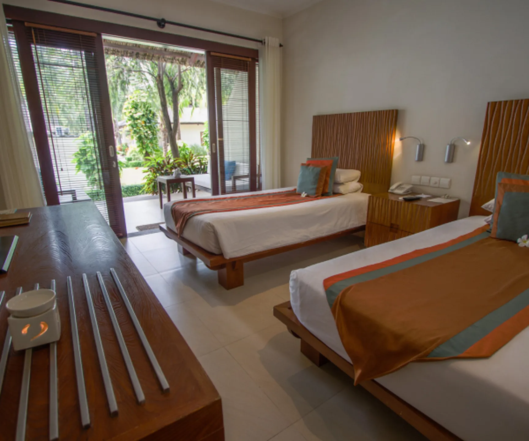 garden view bungalow bedroom with terrace and tropical garden at Blue Ocean Resort Mui Ne Vietnam