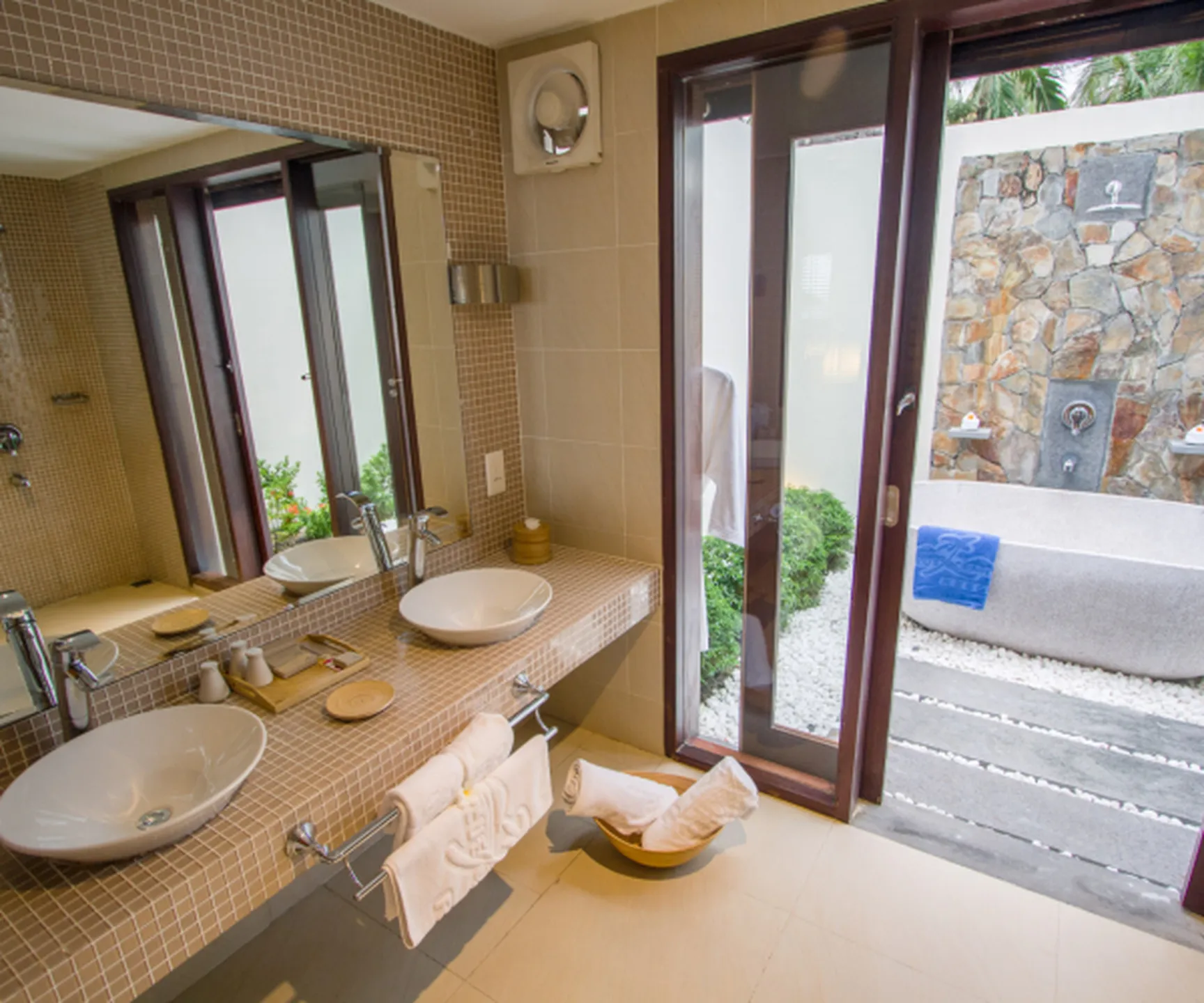  modern bathroom with double sinks and outdoor bath area in sea view bungalow Mui Ne resort 