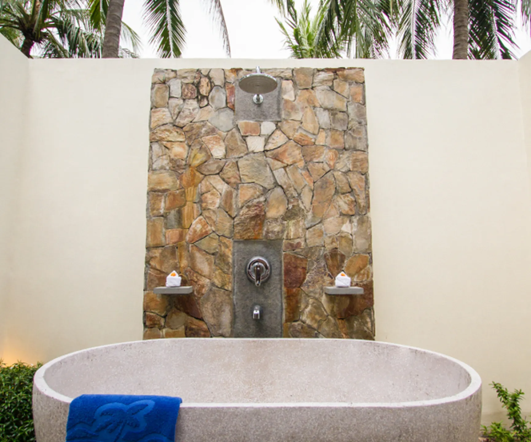  outdoor stone bathtub and shower in sea view bungalow at Blue Ocean Resort Mui Ne Vietnam 