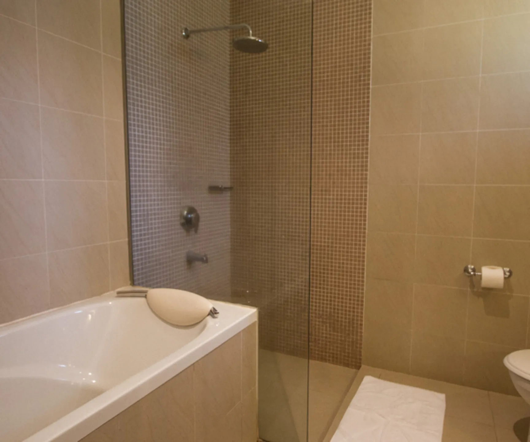  Spacious bathroom with bathtub and walk-in shower in sea view family bungalow at Blue Ocean Resort Mui Ne 